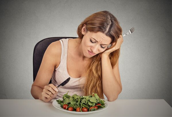 A girl eating greens on a Mediterranean diet